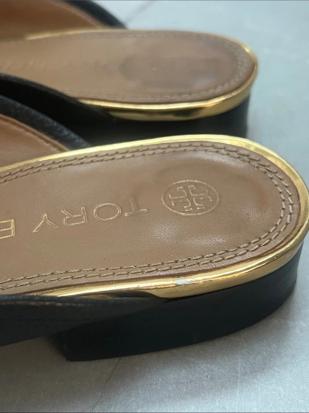 Tory Burch Jessa Backless Loafers in black pebbled leather